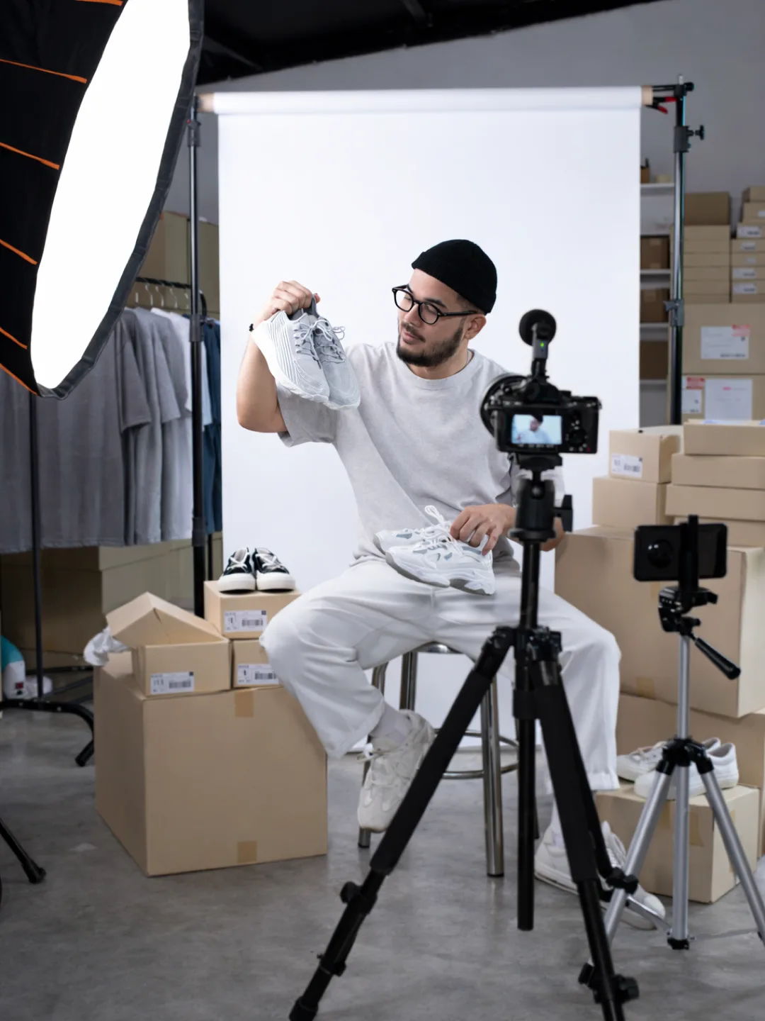 Micro influencer filming a product review in a studio setup